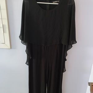 Black pantsuit with attached wraparound cape